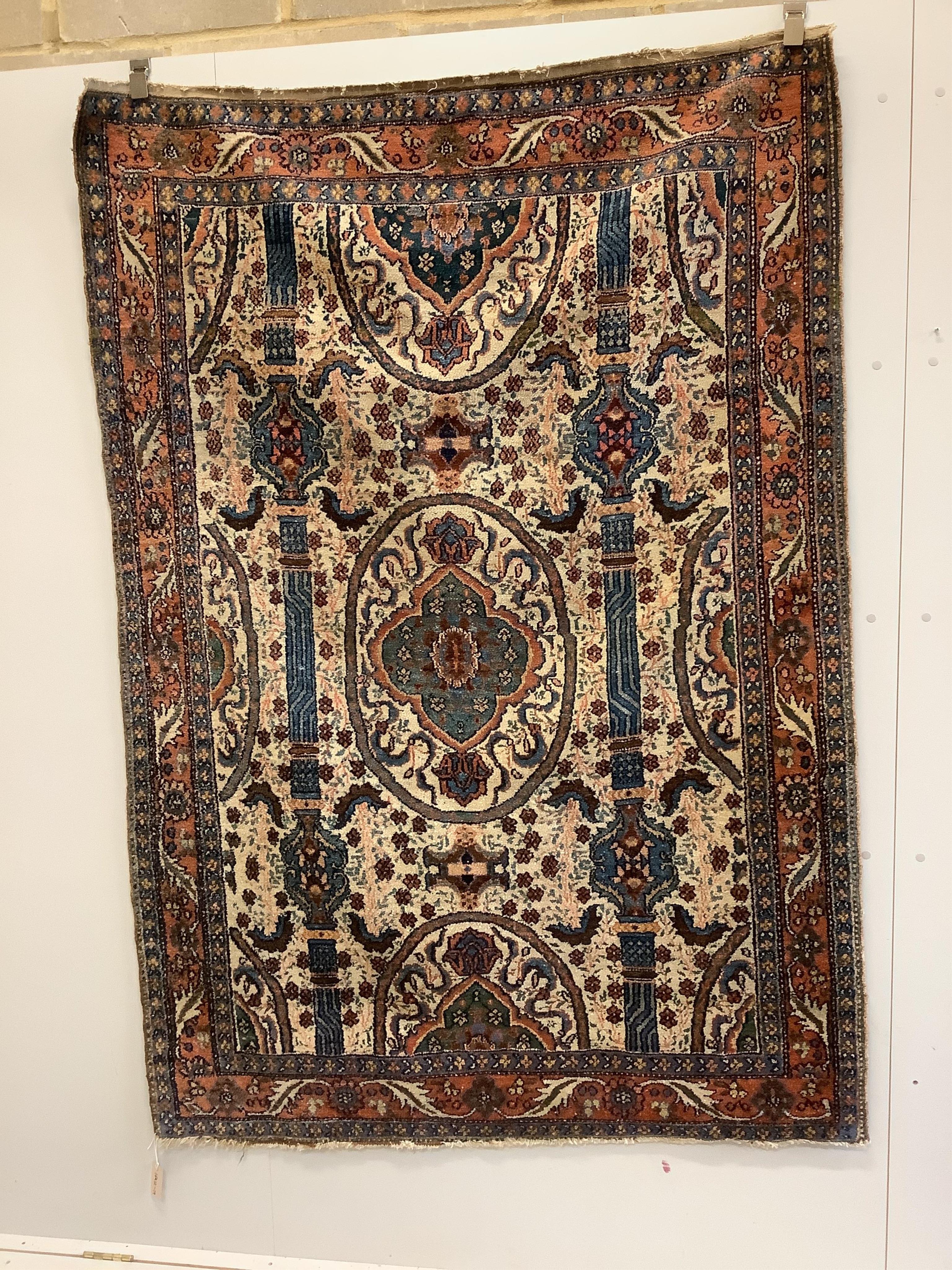 A North West Persian ivory ground rug, 200 x 142cm. Condition - fair